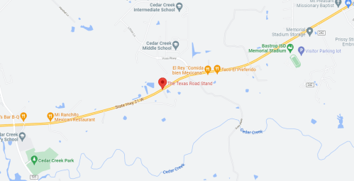 Map showing a location on State Highway 21, near Cedar Creek, Texas, with nearby landmarks and restaurants.