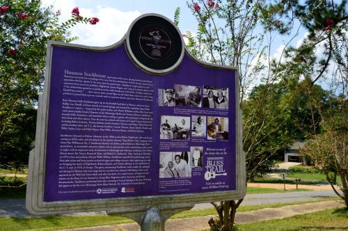 Historical marker about Houston Stackhouse, featuring text and images related to his contributions to music.