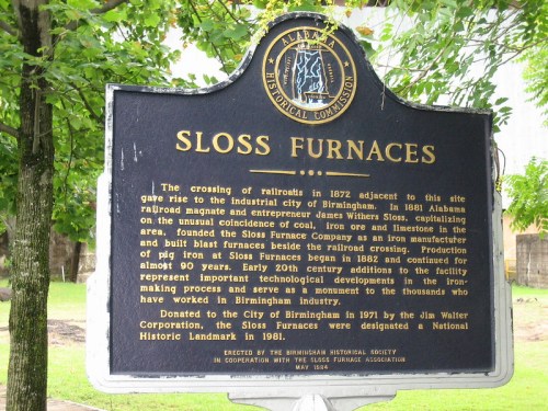 Historical marker about Sloss Furnaces, detailing its significance in Birmingham's industrial history and railroad development.