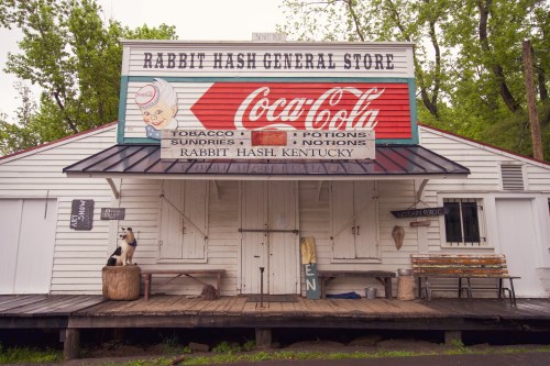 Historic Rabbit Hash General Store in Kentucky, featuring a vintage Coca-Cola sign and rustic wooden architecture.
