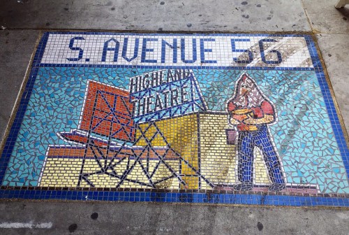 Mosaic artwork on pavement featuring "S. Avenue 56" and a depiction of a man near the Highland Theater sign.
