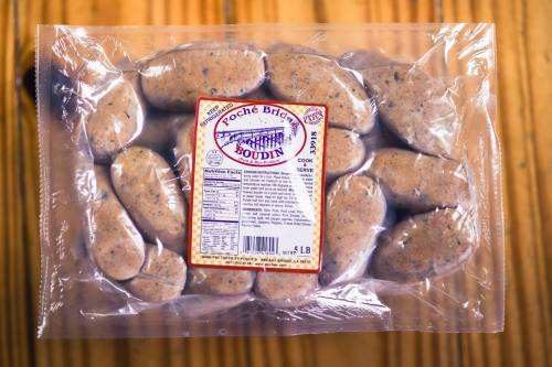 Packaged boudin sausage links in a clear plastic tray with a colorful label on top.