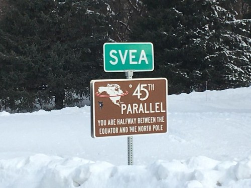 Sign marking the 45th parallel, indicating it's halfway between the Equator and the North Pole, near Svea.