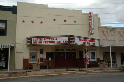 The Lan-Tex Theater marquee displays upcoming shows for Curtis Potter and Justin Trevino, and Elizabethtown.