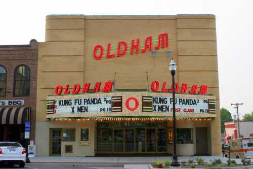 Historic Oldham theater with a marquee displaying "Kung Fu Panda" and "X-Men" films. Classic architecture and signage.