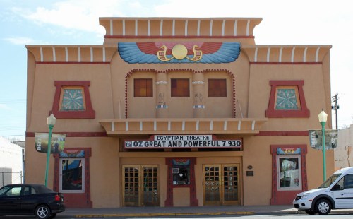 Historic Egyptian Theatre with colorful facade and marquee displaying "Oz: The Great and Powerful."