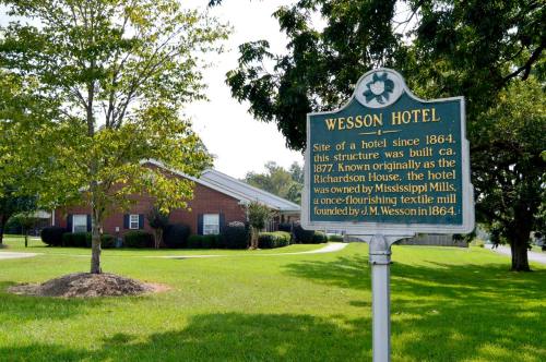 Historical marker for Wesson Hotel, built circa 1877, originally known as the Richardson House, in a grassy area.