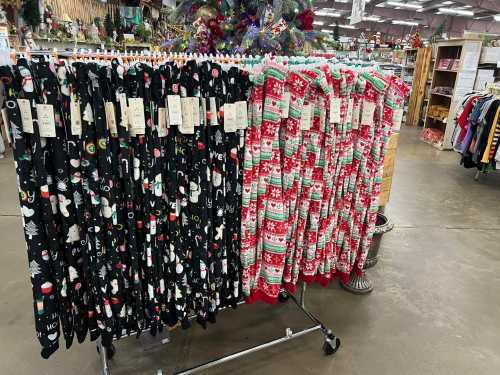 A display of festive holiday socks in various patterns, hanging on a rack in a store.