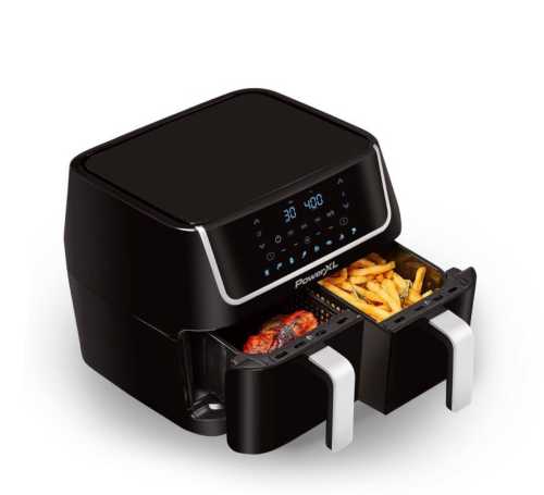 A black air fryer with two drawers, displaying fries and meat, featuring a digital control panel on top.