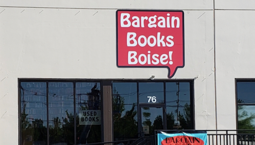 Sign for "Bargain Books Boise!" on a storefront, with a window displaying "USED BOOKS" below.