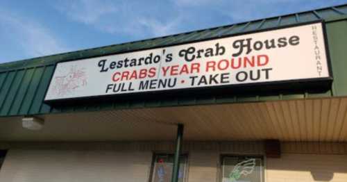 Sign for Lestardo's Crab House, featuring "Crabs Year Round" and "Full Menu Take Out" in bold letters.