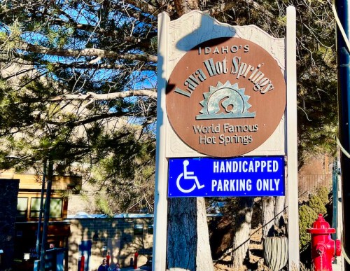 Sign for Idaho's Lava Hot Springs, featuring "World Famous Hot Springs" and a "Handicapped Parking Only" notice.