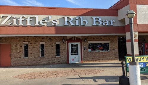 Exterior of Ziffle's Rib Bar, featuring a brick facade and a sign with the restaurant's name.