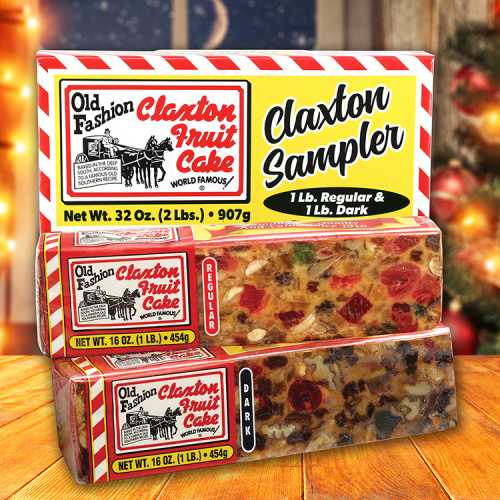 A box of Claxton Fruit Cake sampler featuring regular and dark fruit cakes, set against a festive background.