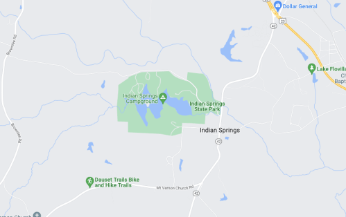 Map showing Indian Springs State Park, including campground and nearby trails, with surrounding roads and landmarks.