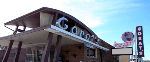 Exterior of Gorat's restaurant featuring a curved roof and a sign that reads "Finest Steaks in the World."