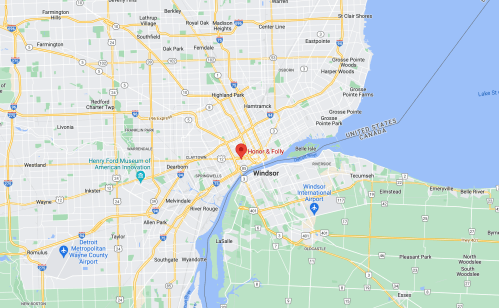 Map showing downtown Detroit, Michigan, with nearby Windsor, Canada, and major landmarks and roads.