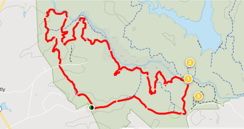 Map showing a winding trail marked in red, with three points of interest indicated along the route.