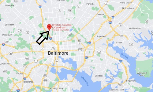 Map of Baltimore highlighting "Crystals, Candles & Cauldrons" with an arrow pointing to its location.