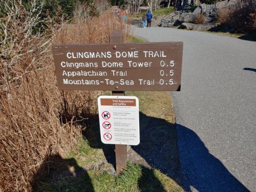 Signpost for Clingmans Dome Trail with distances to Clingmans Dome Tower, Appalachian Trail, and Mountains-To-Sea Trail.