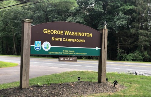 Sign for George Washington State Campground in Rhode Island, surrounded by trees, with a "No Vacancy" notice.
