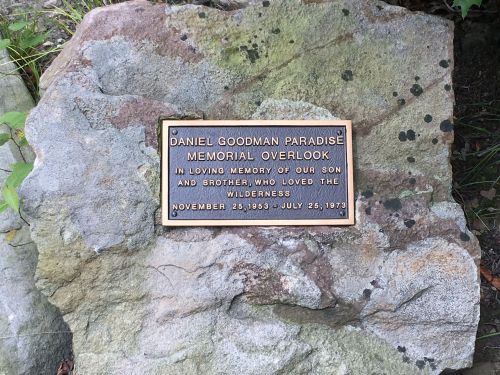 A plaque on a rock honoring Daniel Goodman Paradise, commemorating his love for the wilderness.