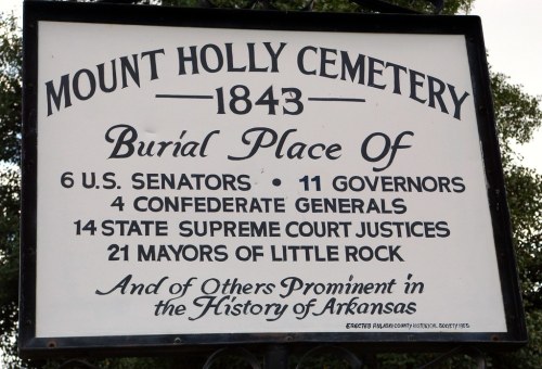 Sign at Mount Holly Cemetery (1843) listing notable burials: 6 U.S. Senators, 11 Governors, and more from Arkansas history.