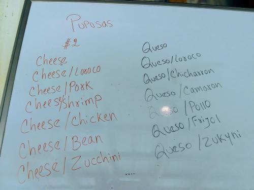 Menu board listing various types of pupusas with prices, including cheese, pork, shrimp, chicken, and zucchini options.