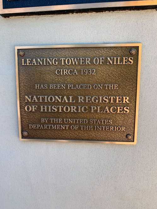 Plaque honoring the Leaning Tower of Niles, placed on the National Register of Historic Places, circa 1932.