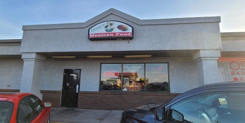 Exterior of Jenny's Mexican Food restaurant, featuring a sign and large windows with "OPEN" displayed.