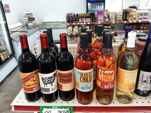 A display of wine bottles with playful labels: "Black Sheep," "Middle Child," "Oldest Child," "Third Child," and "Favorite Child."