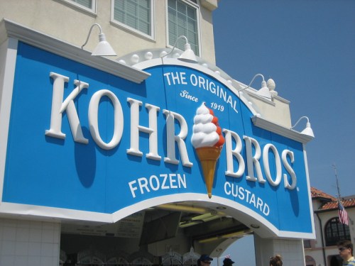 Sign for Kohr Bros Frozen Custard, featuring a large ice cream cone graphic and bright blue background.