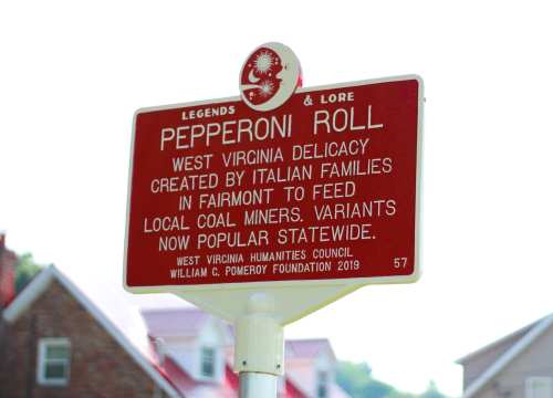 Sign about the Pepperoni Roll, a West Virginia delicacy created by Italian families for coal miners, now popular statewide.