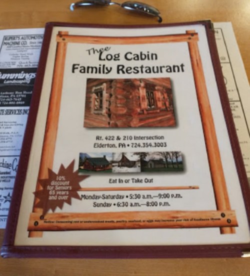 Menu cover for The Log Cabin Family Restaurant, featuring hours and contact info in Elderton, PA.