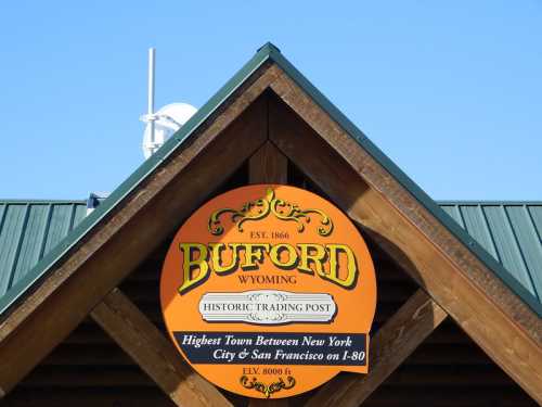 Sign for Buford, Wyoming, featuring "Historic Trading Post" and stating it's the highest town on I-80.