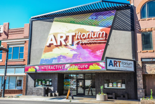 Colorful exterior of ARTitorium on Broadway, featuring vibrant signage and a modern design.
