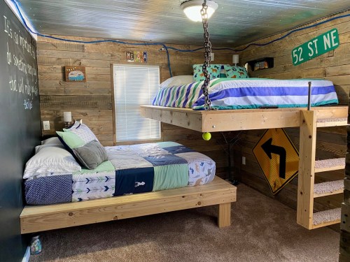 Cozy bedroom with a wooden loft bed, a lower bed, and rustic decor, featuring a mix of patterns and a playful vibe.