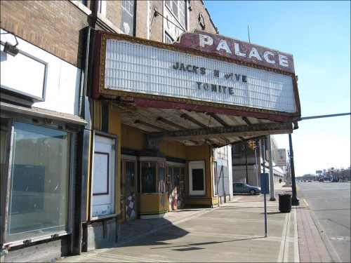 Exterior of the Palace Theater with a marquee reading "Jack's Live Tonight," set on a sunny street.