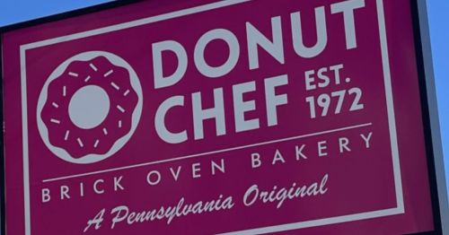 Sign for Donut Chef, a brick oven bakery established in 1972, featuring a donut graphic and "A Pennsylvania Original."