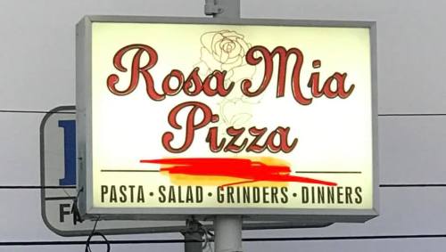 Sign for Rosa Mia Pizza featuring the name and offerings: pasta, salad, grinders, and dinners.