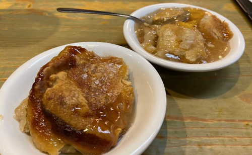 Two bowls of dessert: one with a golden-brown pastry and the other with a sweet, syrupy mixture.