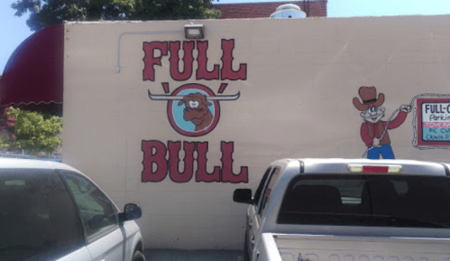 A mural on a wall featuring the words "FULL BULL" with a cartoon bull and a cowboy character.