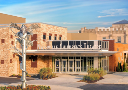 Exterior of Nashville Children's Theatre, featuring a modern building and a decorative sculpture at the entrance.