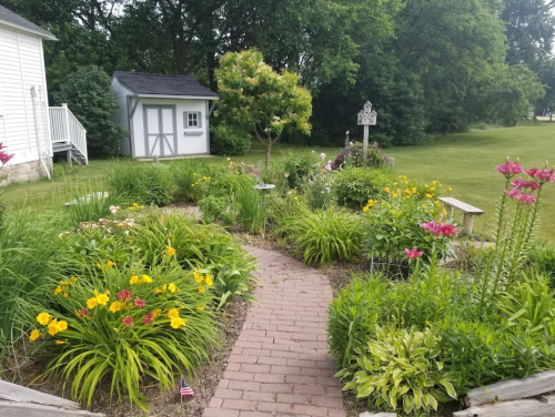 A vibrant garden path lined with colorful flowers, leading to a shed and surrounded by lush greenery.