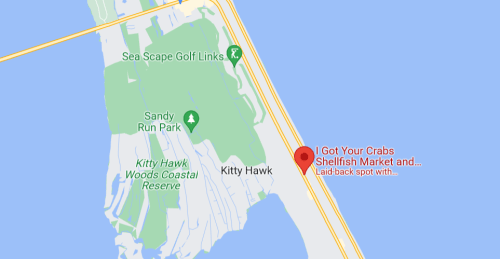 Map showing Kitty Hawk area with "I Got Your Crabs Shellfish Market" marked as a laid-back spot near the coast.