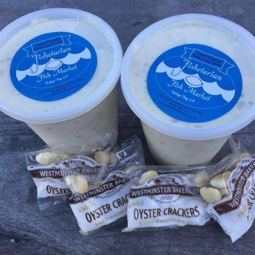 Two containers of seafood chowder from Fishtarian Fish Market, accompanied by packages of oyster crackers.