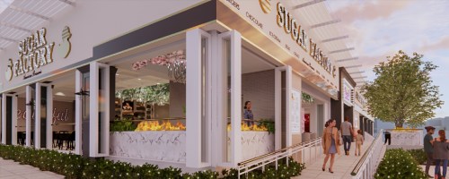 A modern ice cream shop with outdoor seating, featuring a stylish facade and greenery around the entrance.
