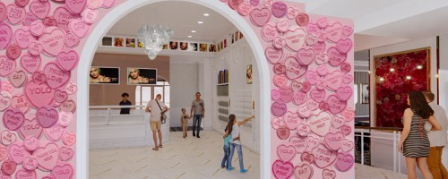 A bright, modern café with pink heart-shaped decorations and people enjoying the space.