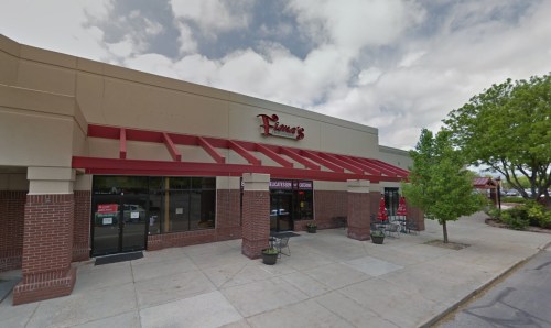 Exterior view of a restaurant named "Franna's," featuring a red awning and large windows on a cloudy day.