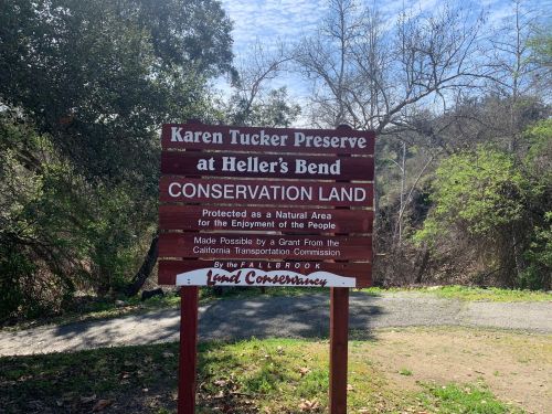 Sign for Karen Tucker Preserve at Heller's Bend, indicating conservation land protected for public enjoyment.